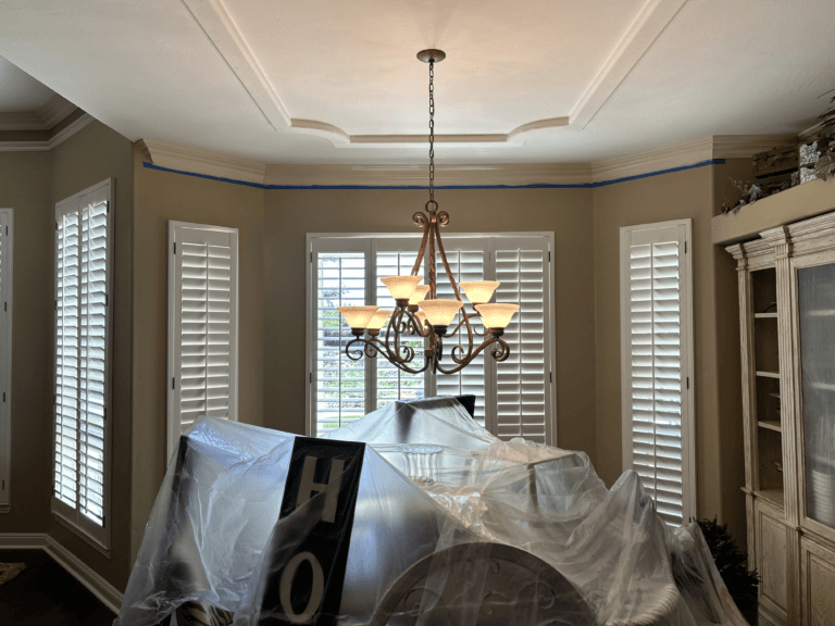 Living Room Painting with covered furniture with painted walls and ceilings