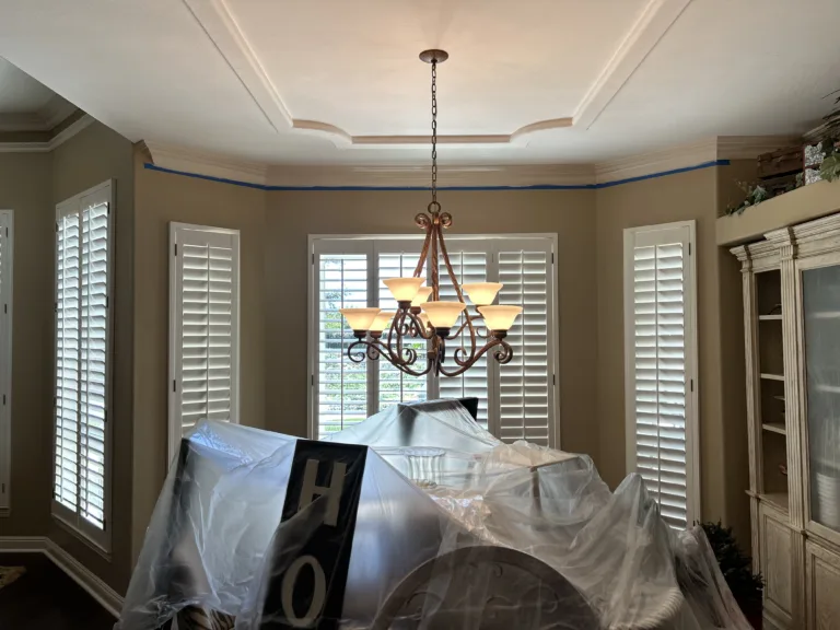 Living Room Painting with covered furniture with painted walls and ceilings